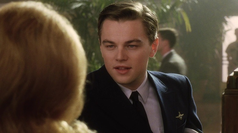 Leonard DiCaprio as Frank Abagnale Jr. chats with a bank teller in Catch Me If You Can