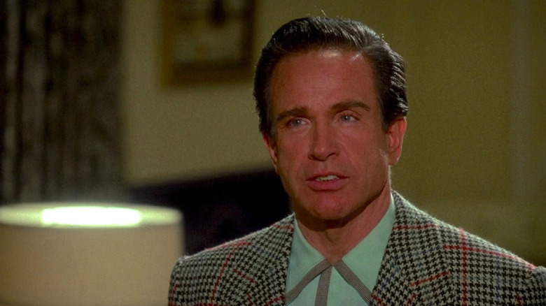 Warren Beatty looking attentive as Bugsy Siegel in Bugsy