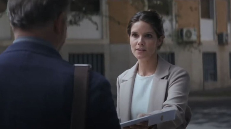 Sonya Cassidy's Allison handing a device to David Costabile's David on Soulmates