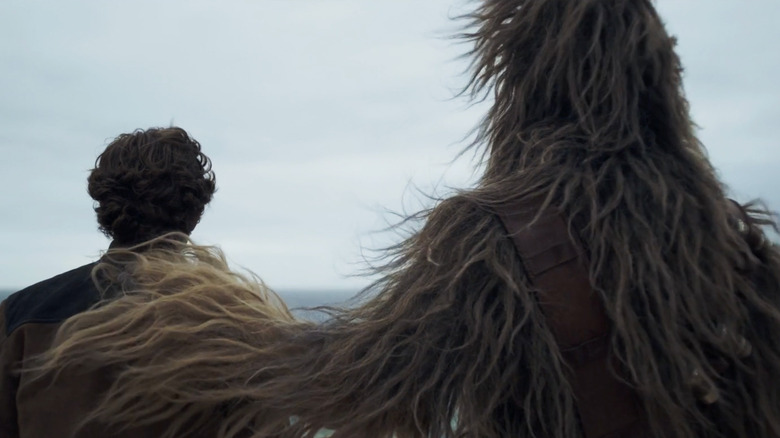 Chewbacca (Joonas Suotamo) comforts Han Solo (Alden Ehrenreich) in Solo: A Star Wars Story