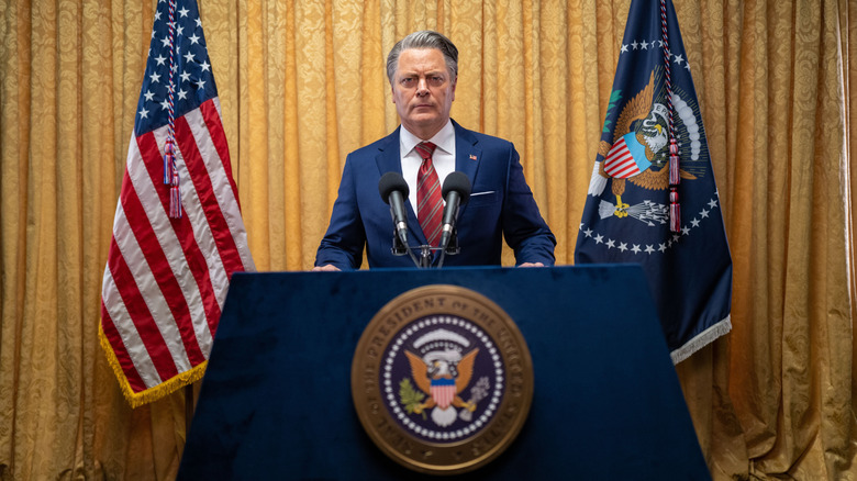 Nick Offerman as the President speaking at the podium in Civil War