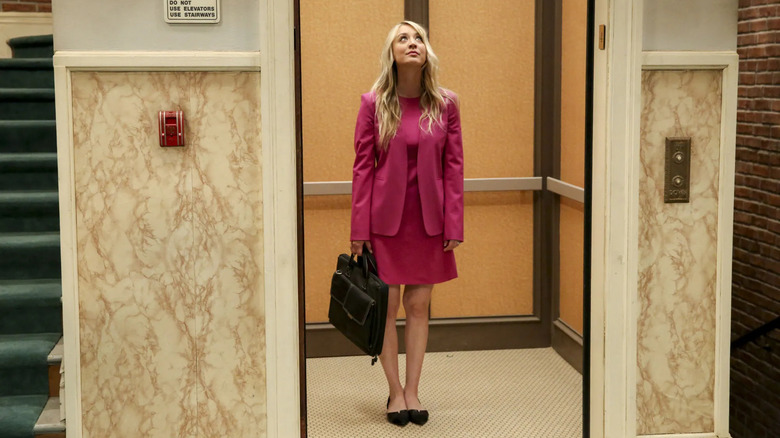 Penny looking up in the working elevator on The Big Bang Theory