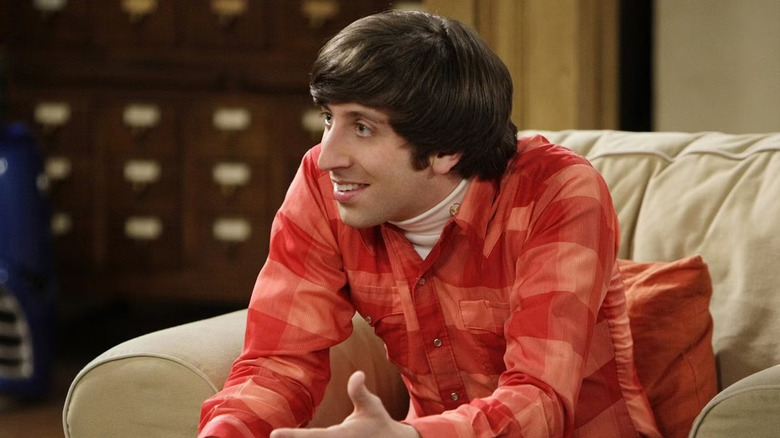 Howard on couch leaning forward Big Bang Theory