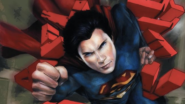 Smallville season 11 comic cover Superman flying through Smallville title text