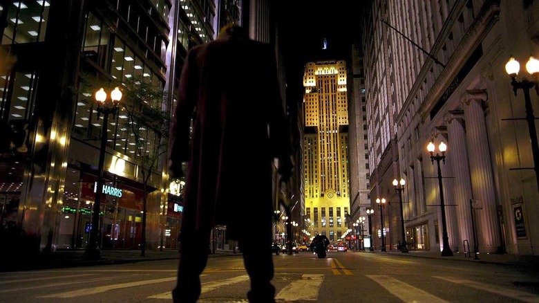 The Joker awaits the Batman on the streets of Gotham 