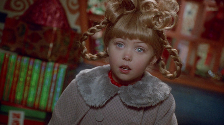 Cindy Lou Who, in full Christmas regalia, looking concerned in How the Grinch Stole Christmas