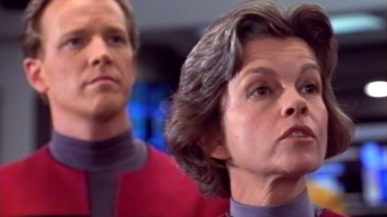 Robert Duncan McNeill as Paris behind Geneviève Bujold as Captain Janeway