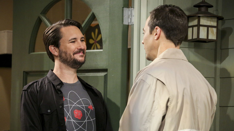 Wil Wheaton smiling and talking to Sheldon in a doorway on The Big Bang Theory