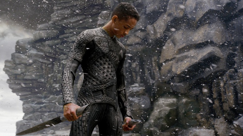 Jaden Smith clutching a weapon