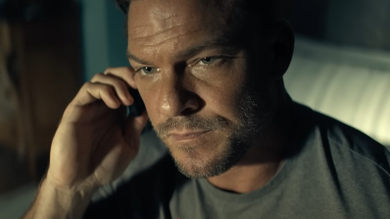 Reacher talking on a cell phone in Reacher Season 3