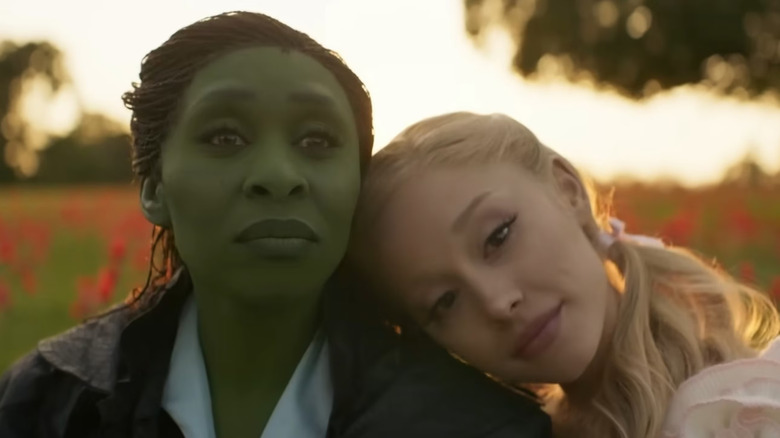 Glinda leaning her head on Elphaba's shoulder in Wicked