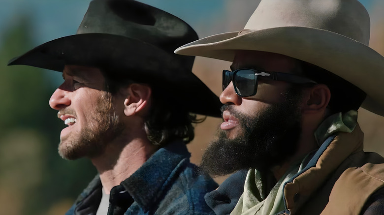 Ryan and Colby staring into the distance on "Yellowstone"