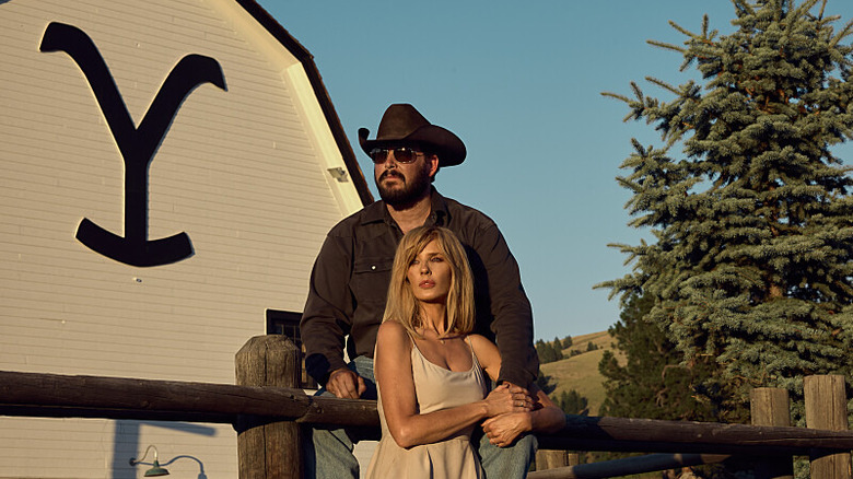 Rip Wheeler and Beth Dutton stand together outside the Yellowstone ranch