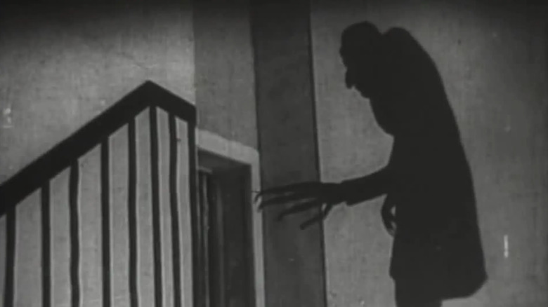 The shadow of Count Orlok by the stairwell in Nosferatu (1922)