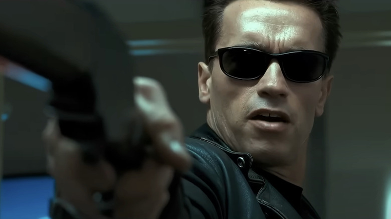 Arnold Schwarzenegger's T-800 holds up a shotgun in Terminator 2: Judgement Day