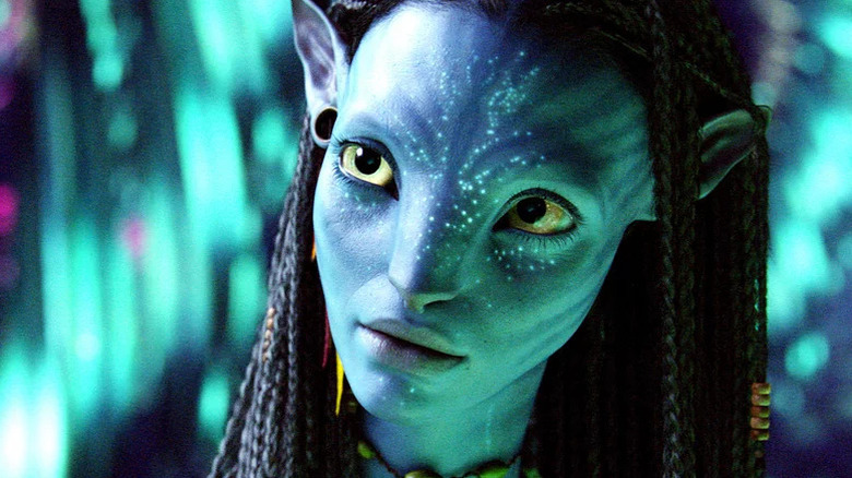 Zoe Saldaña's Neytiri, looking thoughtful in Avatar: Water Way