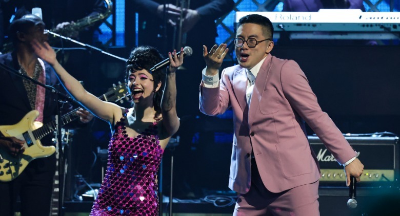 Sarah Sherman and Bown Yang perform with the B-52s at SNL 50: The Homecoming Concert